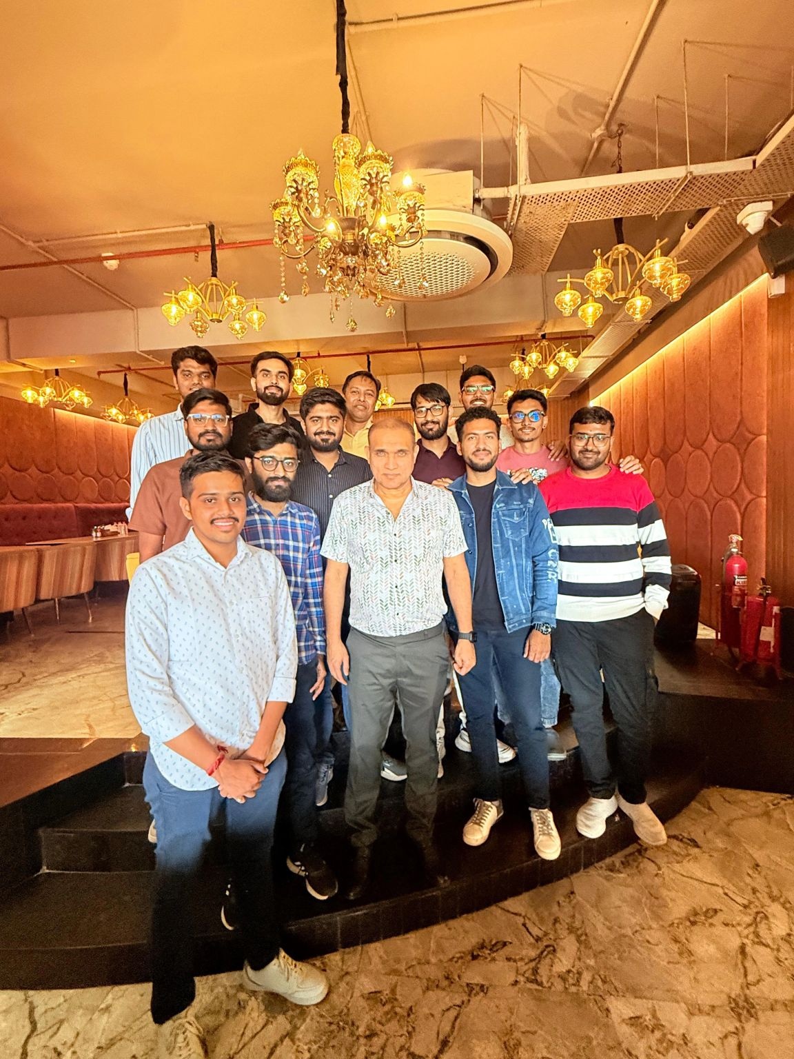 Mike Patel with colleagues in a group photograph at a team lunch