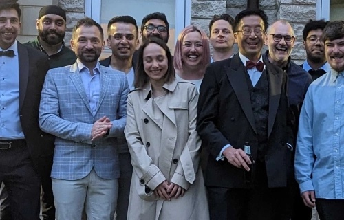 Members of the mkodo team posing together at a company event
