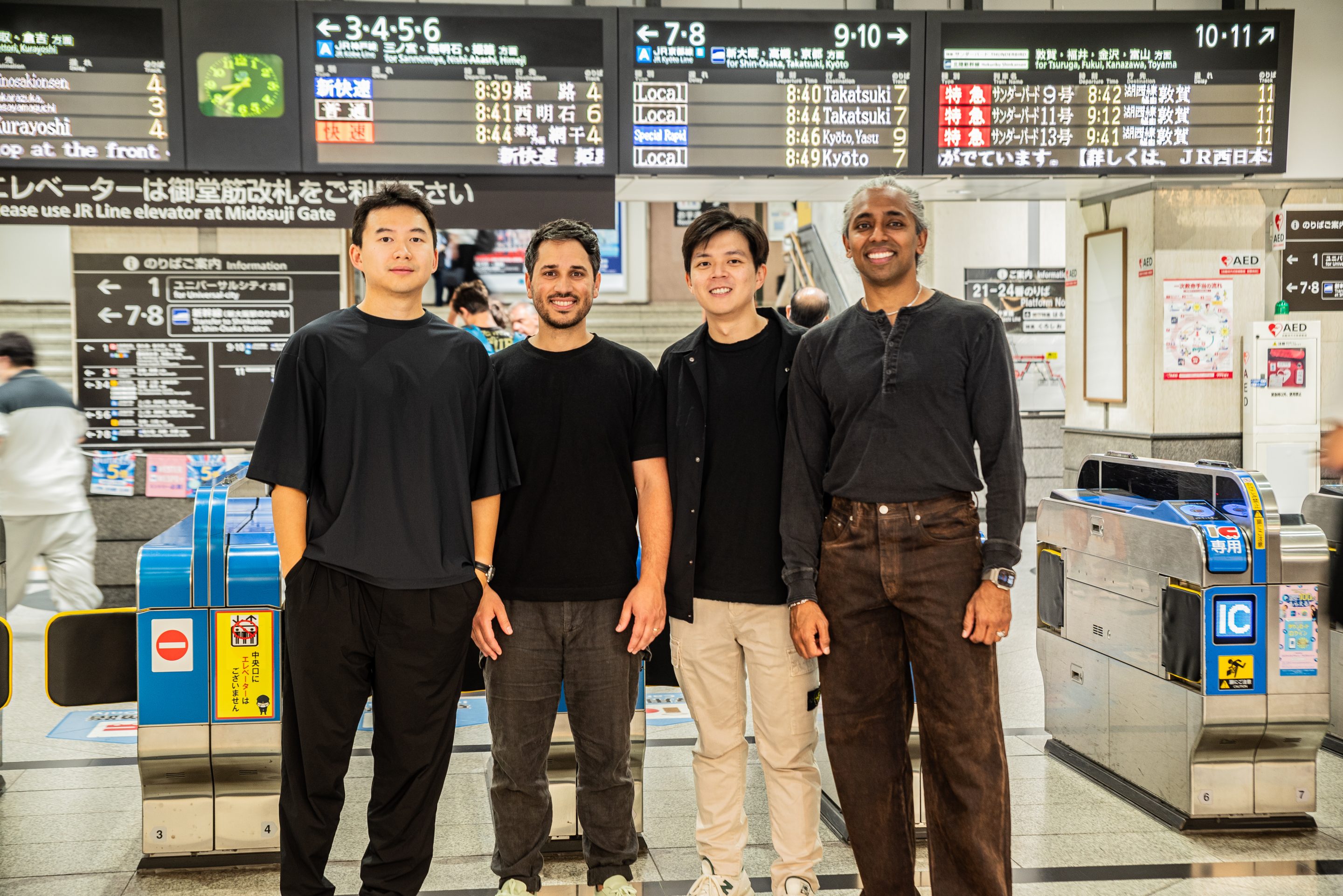 Maximum Frequency Ventures co-founders Alexandre Tang, Neil Harounian, Jerome Ong and Mo Shaikh standing together at a railway station in Japan