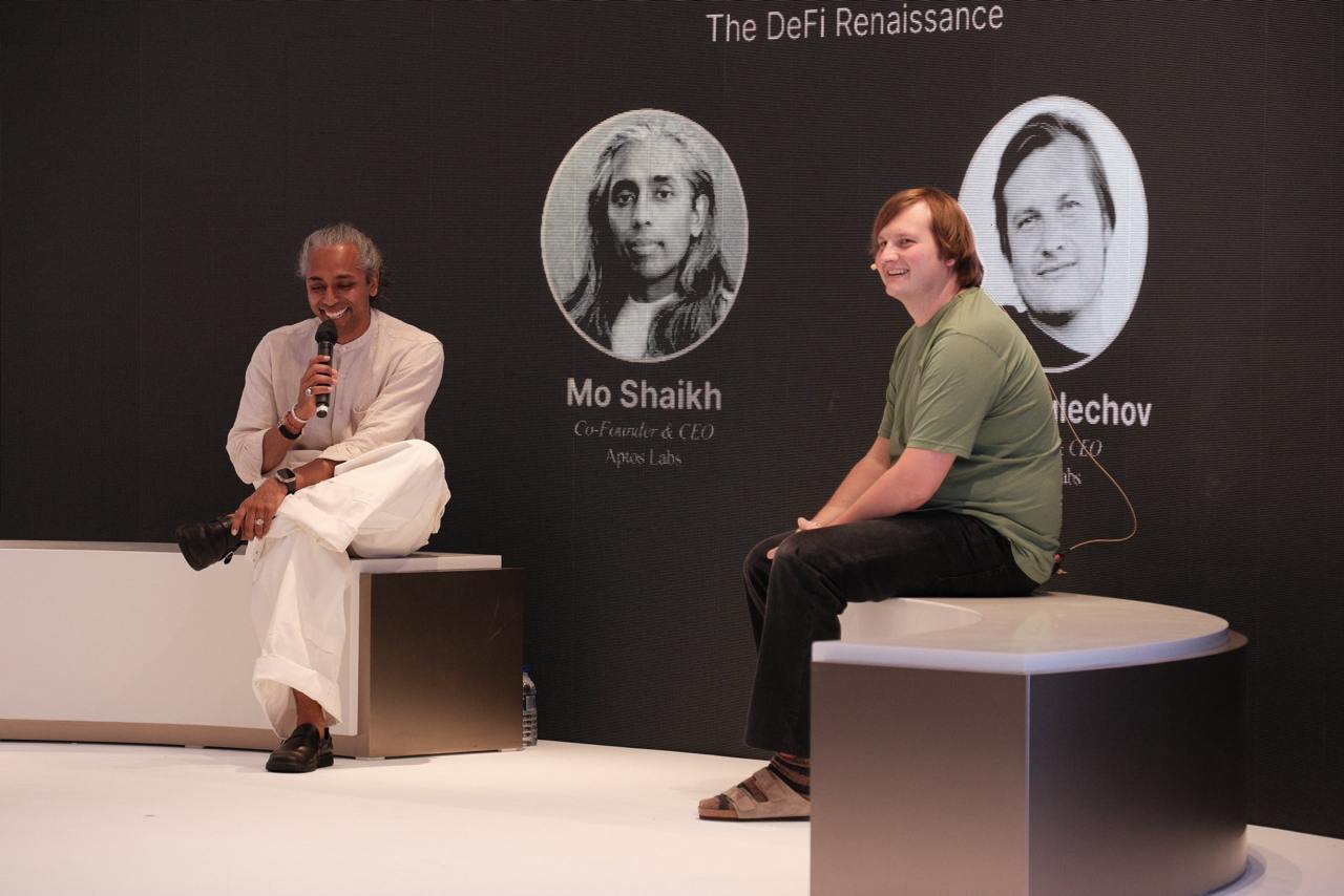 Mo Shaikh speaking onstage in a conversation about decentralized finance
