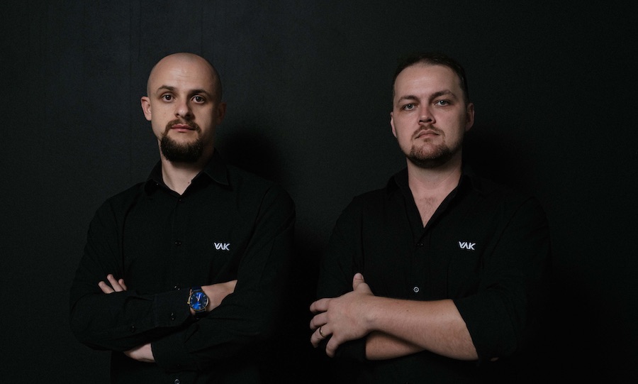 YAK founders João Ozório and Adriano Schalinski wearing black company shirts