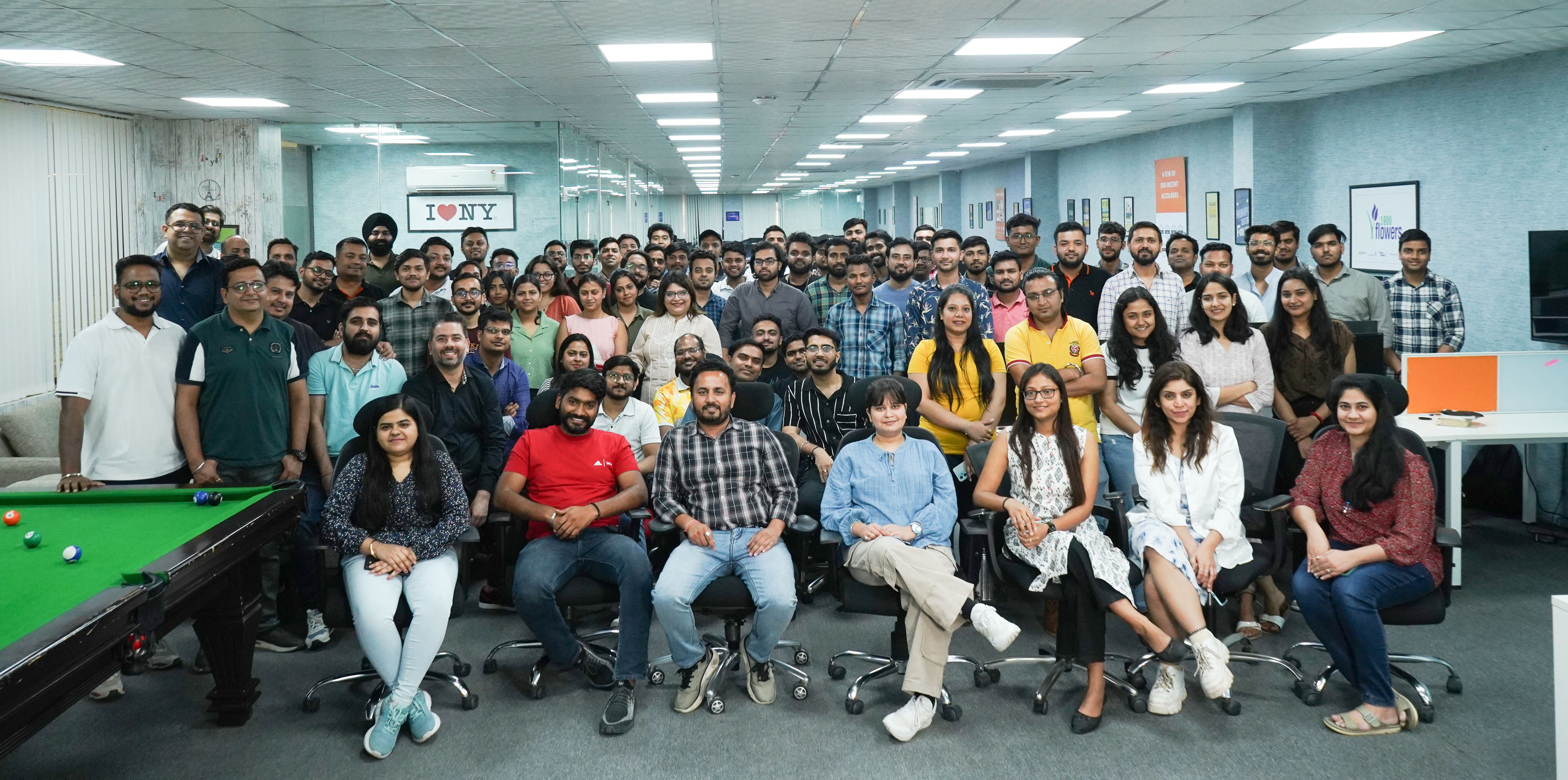 Mobikasa colleagues gathered for a team photograph in an office