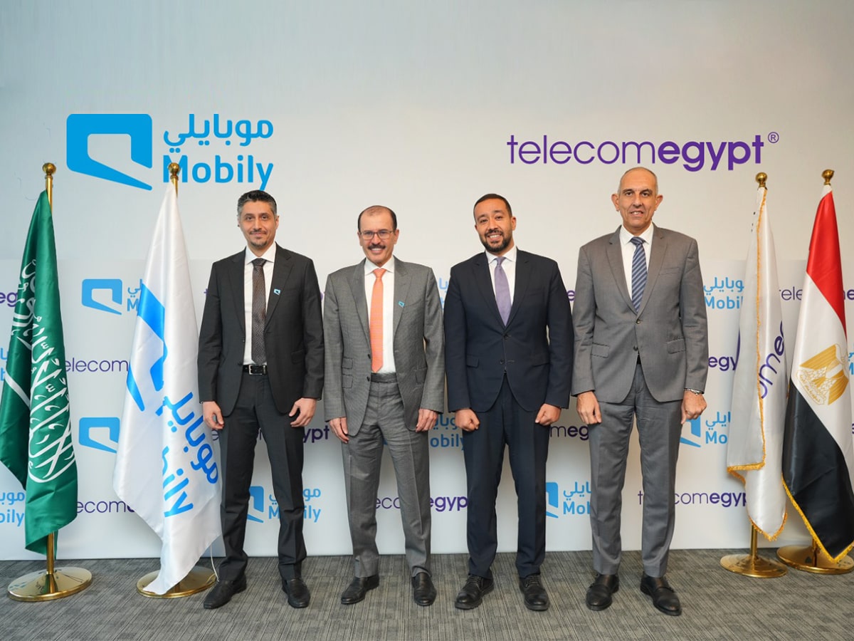Four Mobily and Telecom Egypt representatives stand together at the cable agreement announcement.