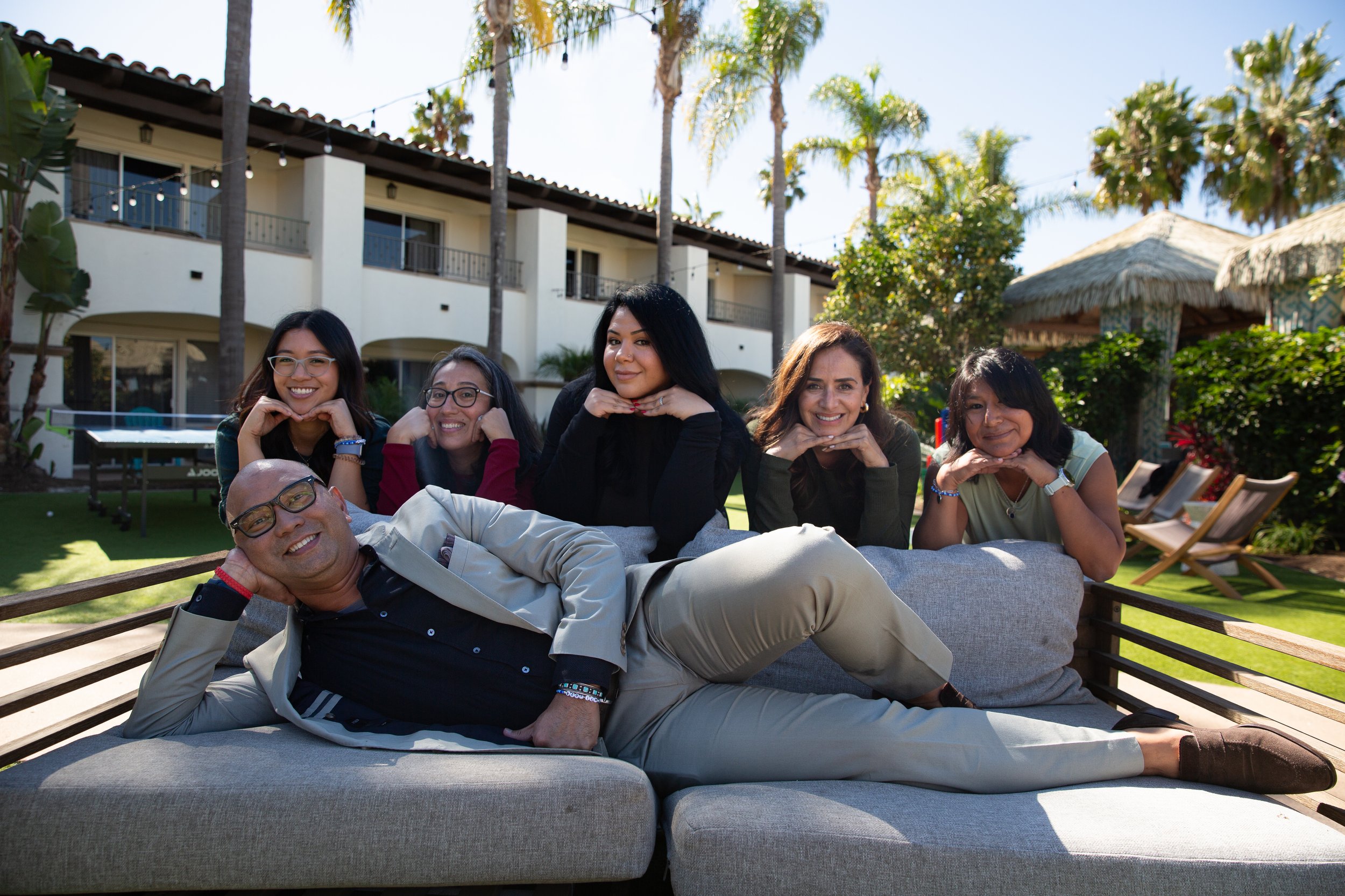 Members of the Modern Times, Inc. team posing together outdoors