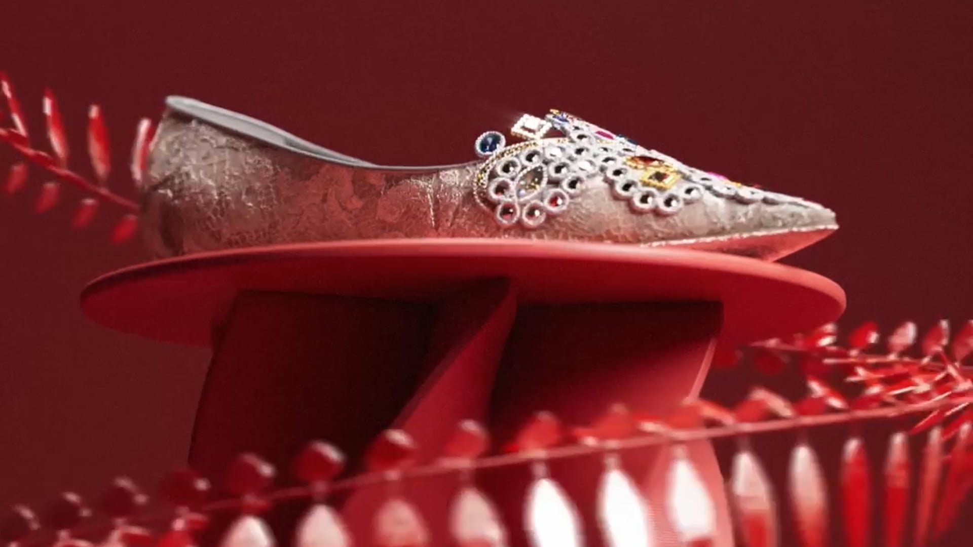 An ornate René Caovilla flat displayed inside a red kinetic sculpture from Modest's Chinese New Year film