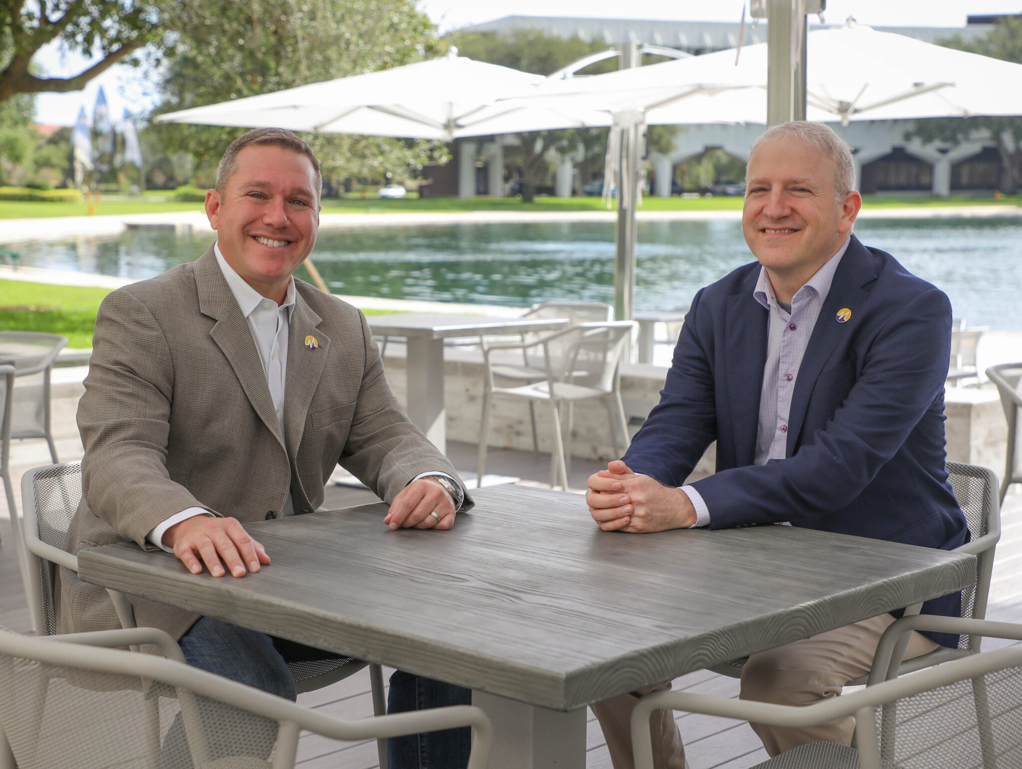 ModMed co-founders Daniel Cane and Michael Sherling seated outdoors