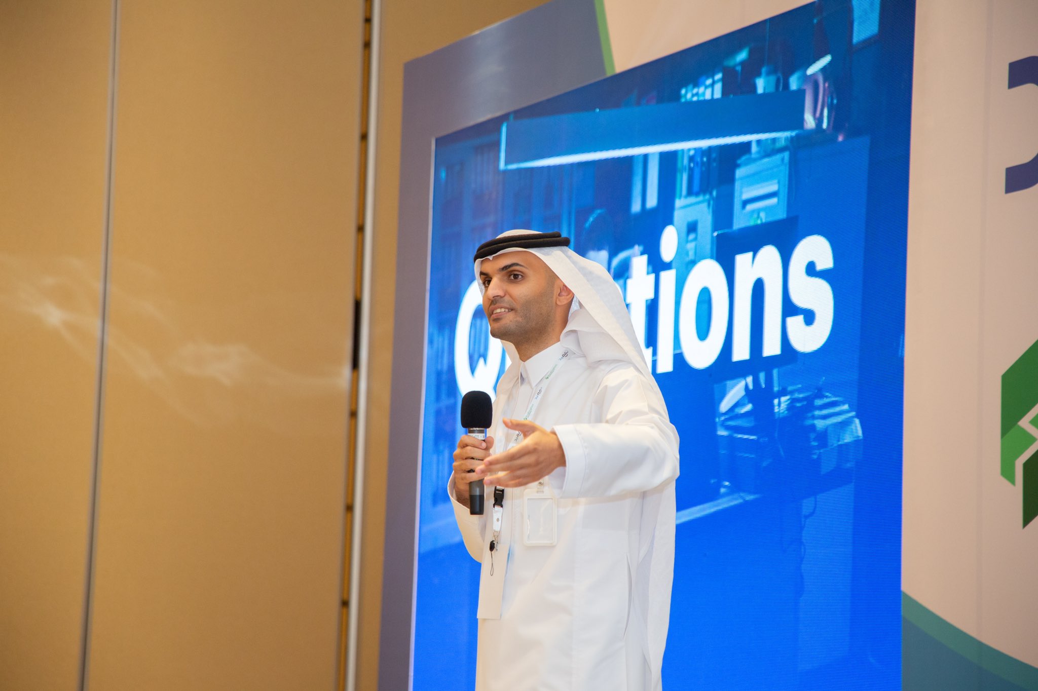 Mohamed Alomayyer speaking with a microphone at Tameed’s Redington workshop