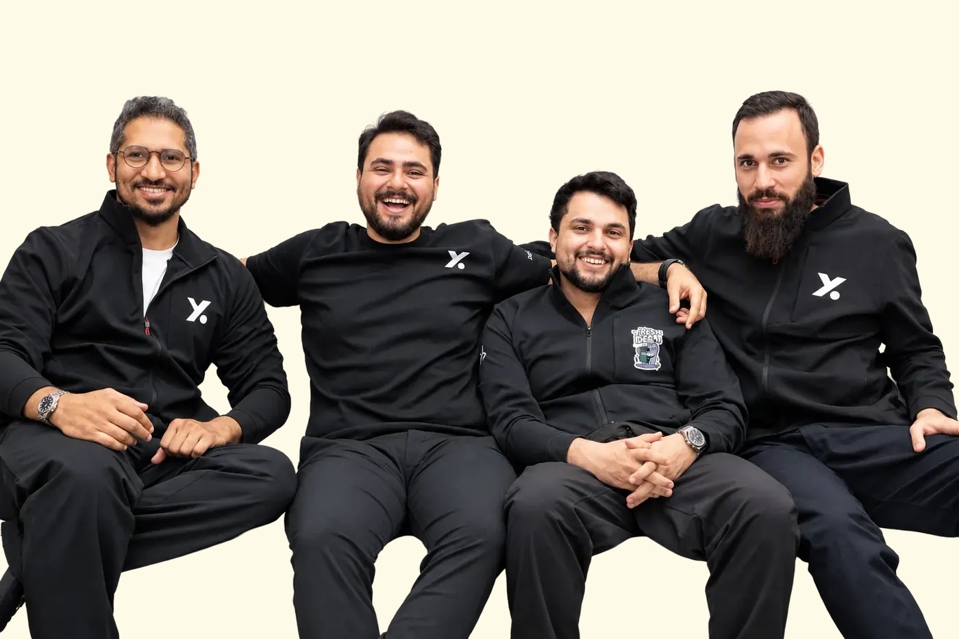 Mohammad Abu Sheikh, second from left, seated with three CNTXT AI teammates