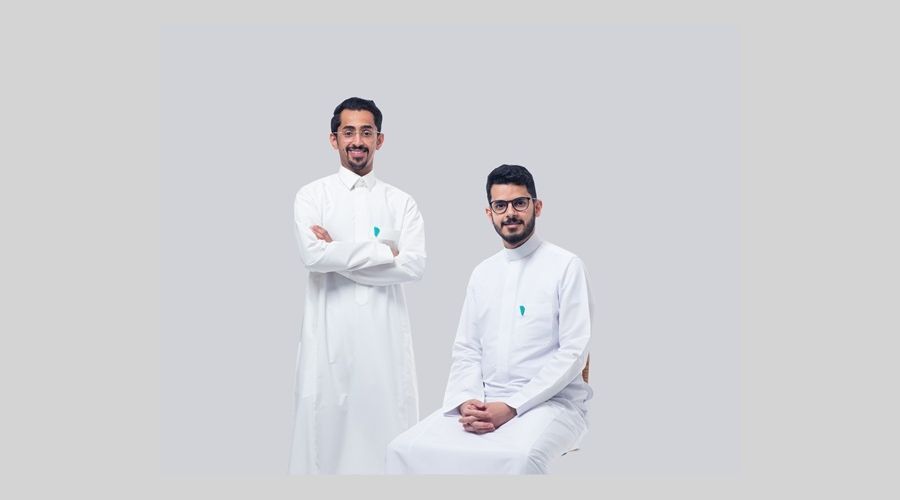 Rewaa co-founders Mohammed Al-Qusair, standing at left, and Abdullah Aljadhai, seated at right