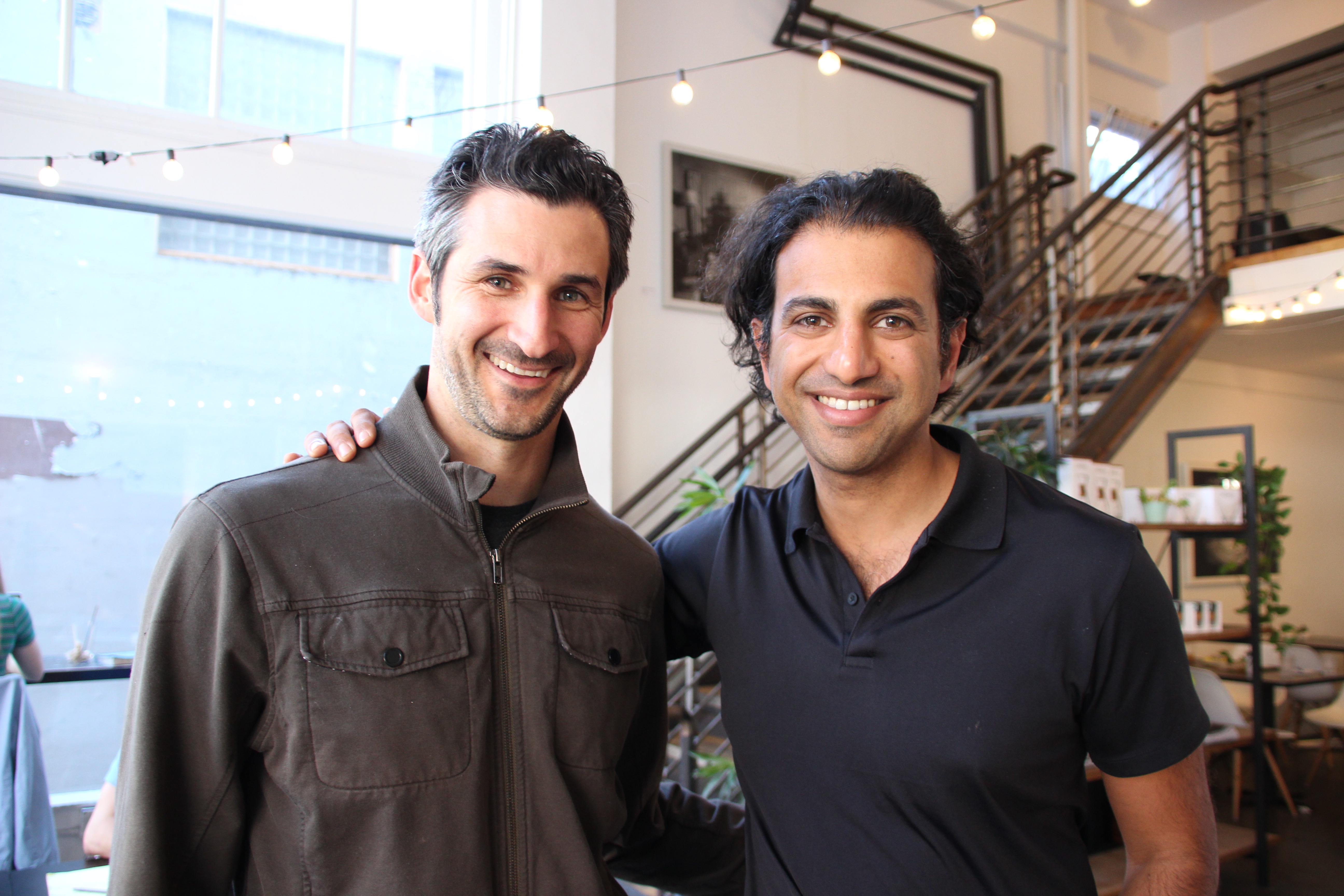 Jeffrey Spector on the left and Mohit Bhende on the right, together in a bright office