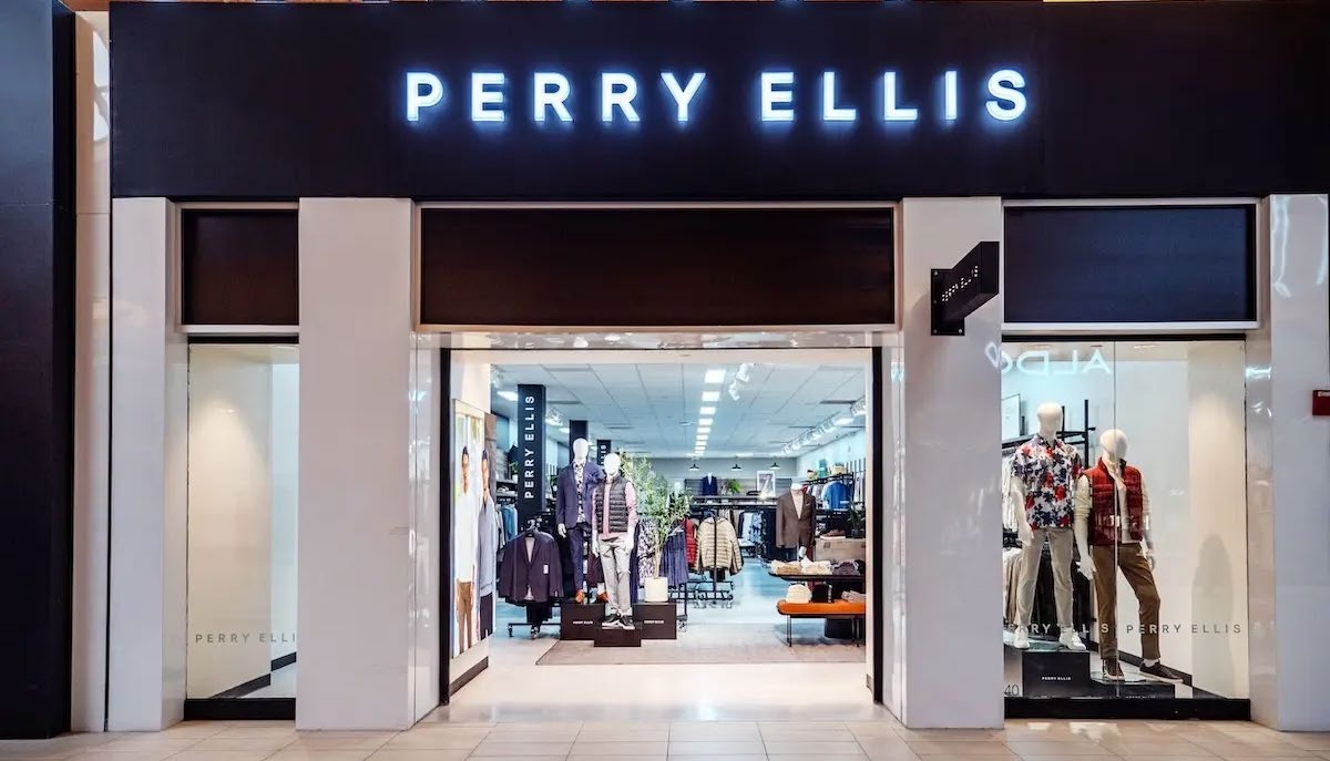 The entrance of a Perry Ellis store, with clothing displays visible inside