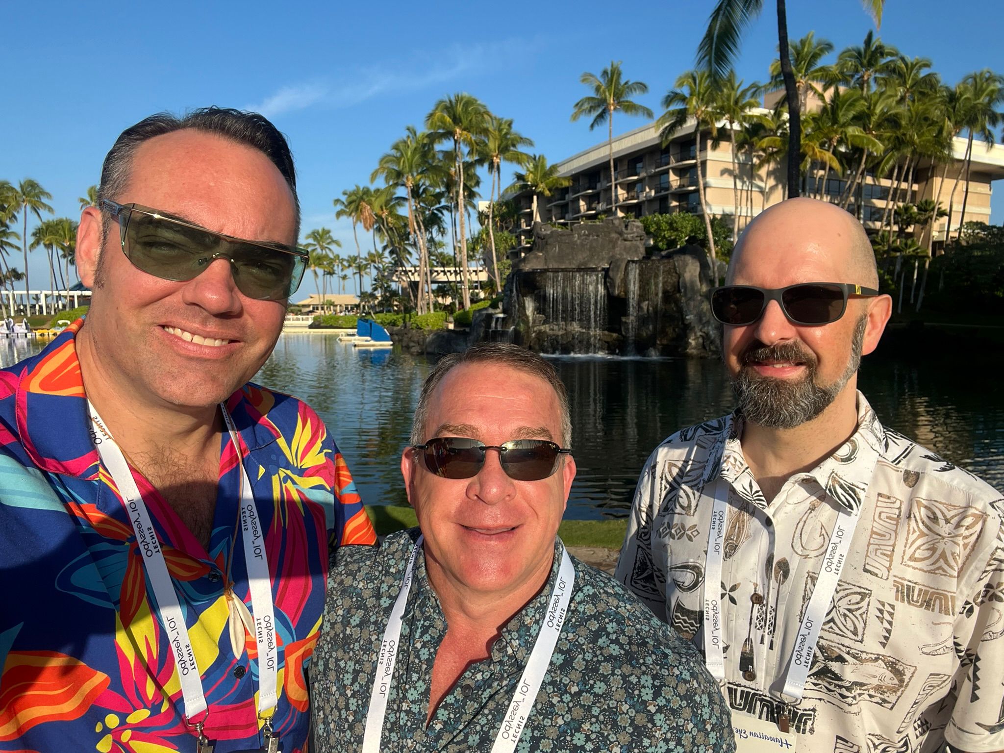 Monty Montoya, center, with two conference companions outdoors at Hawaiian Eye 2026