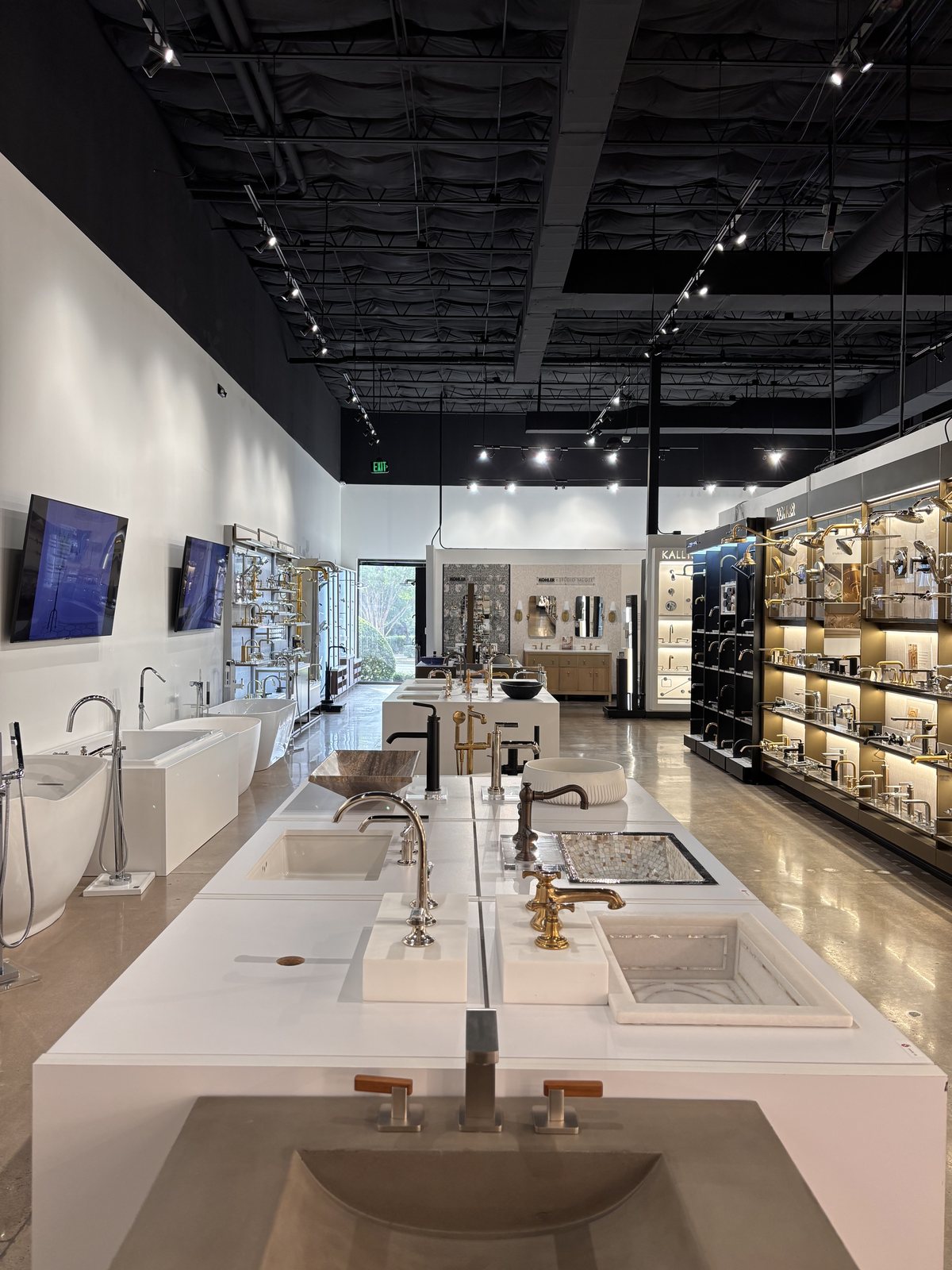 Bath and plumbing displays inside the Facets of Austin showroom