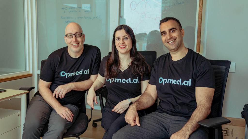 Baruch Barzel, Mor Brokman Meltzer and Avi Paz seated together in matching Opmed.ai shirts