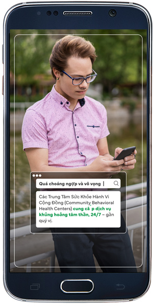 A mobile-phone campaign mockup showing Vietnamese-language guidance for finding a nearby Community Behavioral Health Center