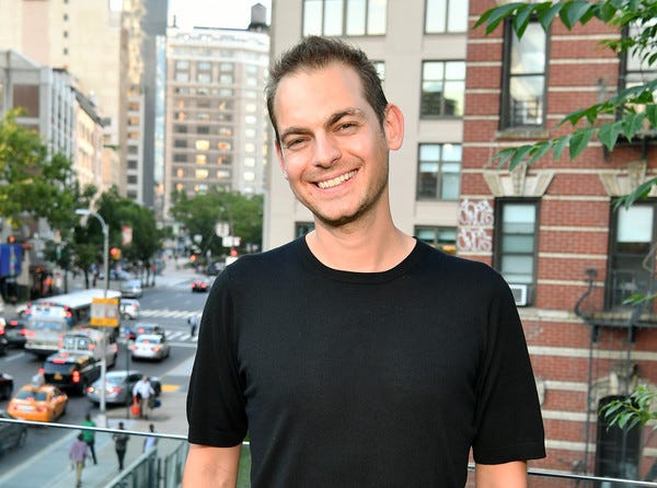 Morgan Hermand-Waiche standing by a balcony above a New York street