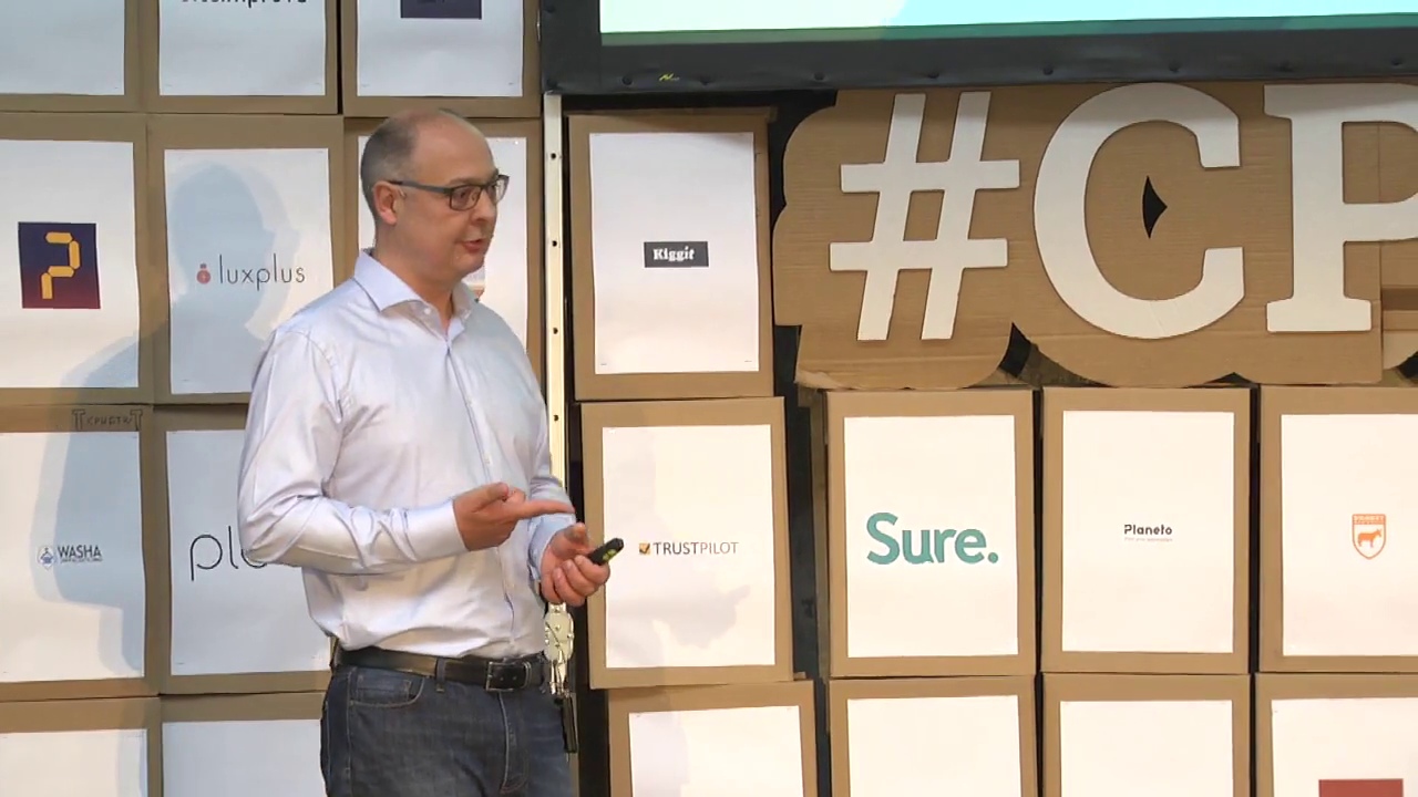 Morten Ebbesen speaking on stage at a Copenhagen startup event in 2016