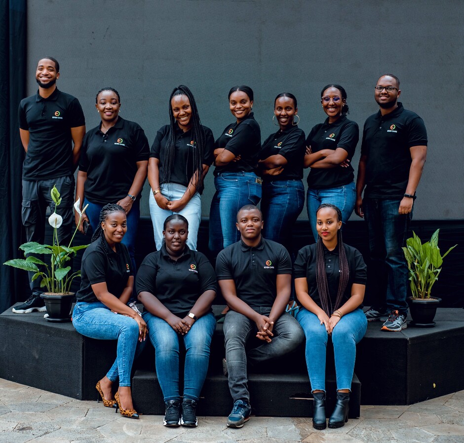 Eden Care team members standing and sitting together outdoors