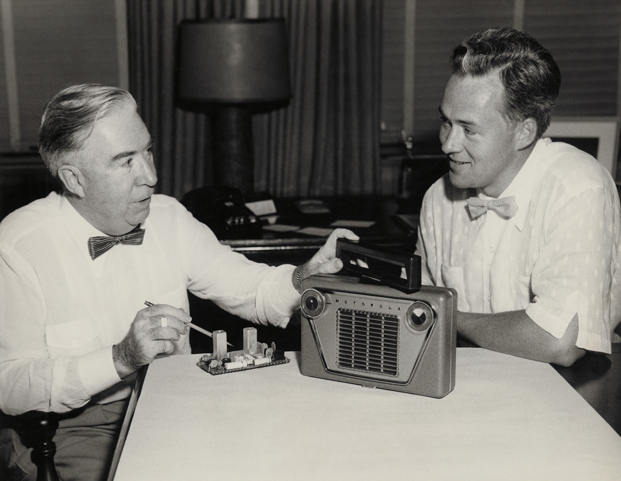 Paul Galvin and his son Bob examining Motorola radio circuitry in 1955