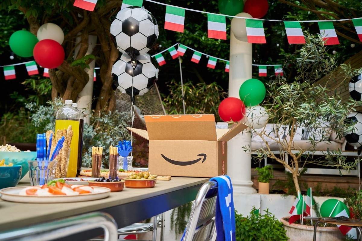 Amazon delivery box in a football-themed garden fan zone decorated for Italy