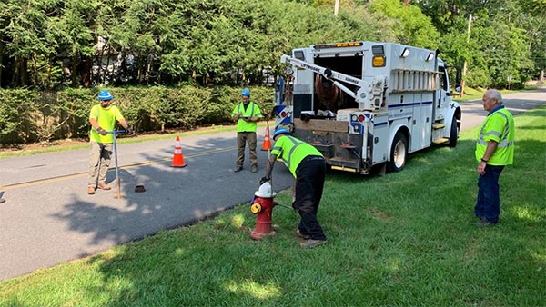 New Jersey American Water crew installing a pressure monitoring retrofit in an existing hydrant