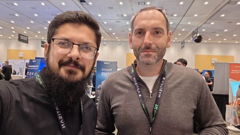 Muhammad Akif Malhi, left, with another attendee at TechCrunch Disrupt 2025.