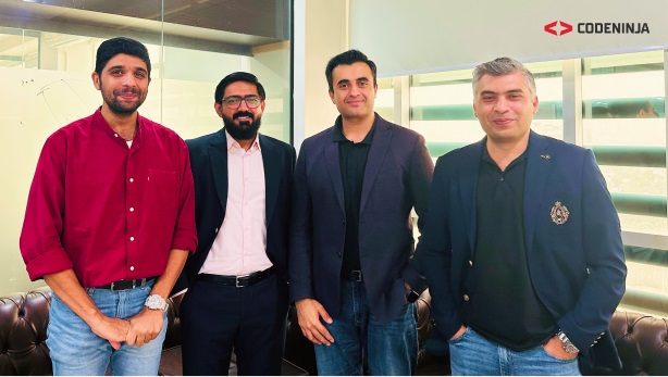 Mukhtar Ahmad Baig, second from left, with colleagues in the photograph accompanying CodeNinja’s funding announcement
