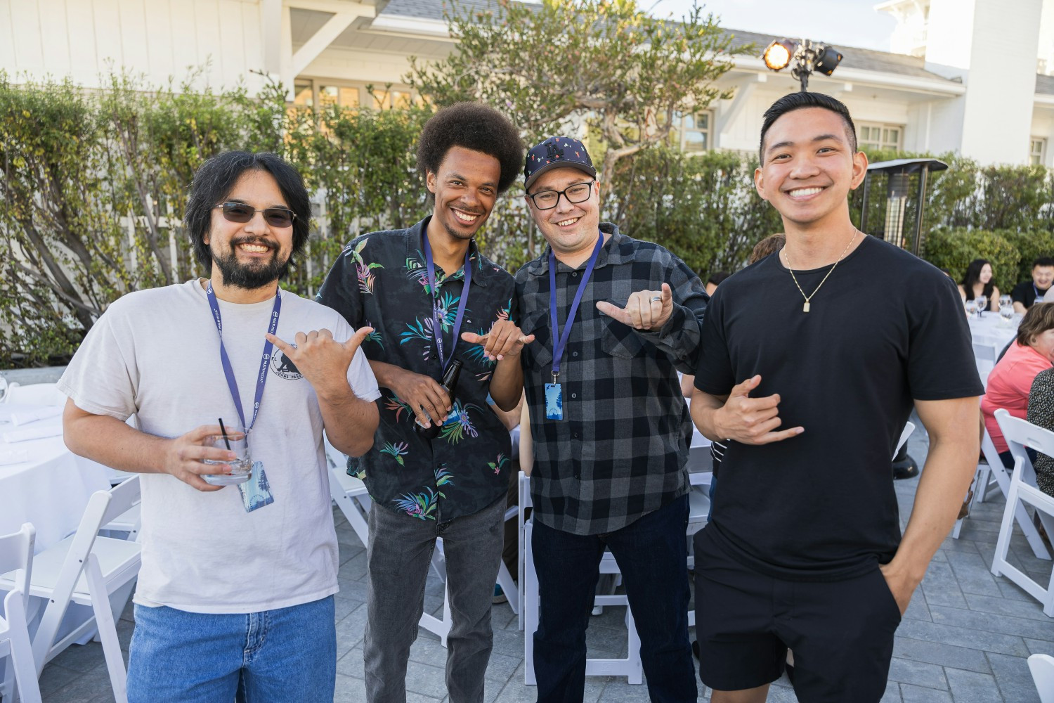 Four Multi Media team members smiling at a company summer event in Santa Monica
