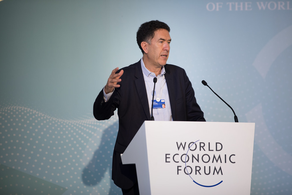 Murat Sönmez speaking at a World Economic Forum lectern during the 2018 Industry Strategy Meeting
