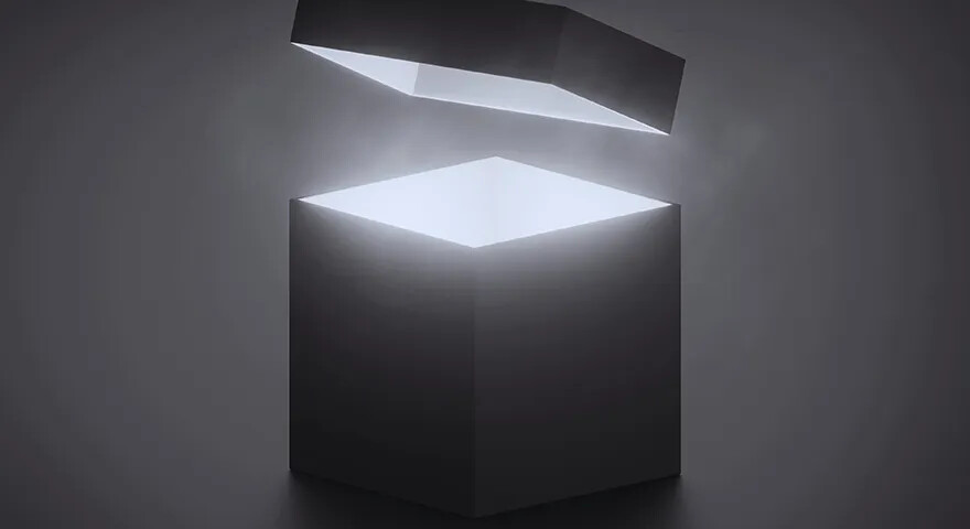 A dark geometric box opened by a bright white light
