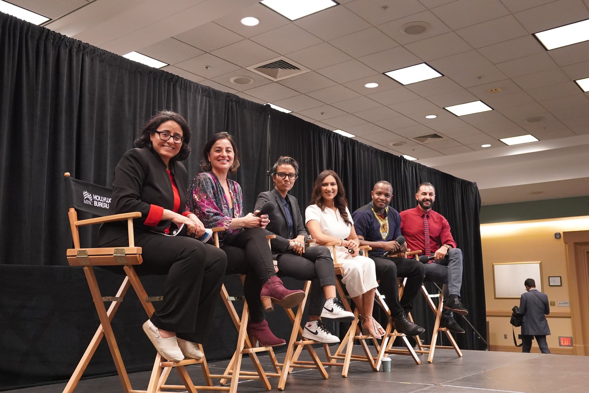 Six panelists seated with microphones at an MPAC Hollywood Bureau event