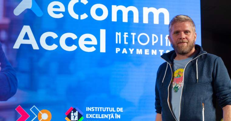 Matei Dumitrescu pictured beside eComm Accel and NETOPIA Payments branding
