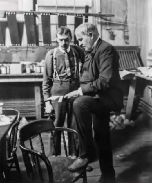 Historical company photograph identified as Lewis Edward Myers and Thomas Edison