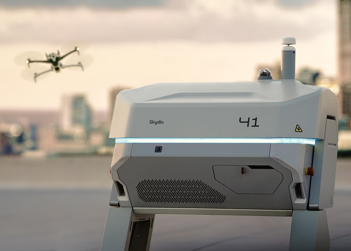 A Skydio drone flying near a docking station