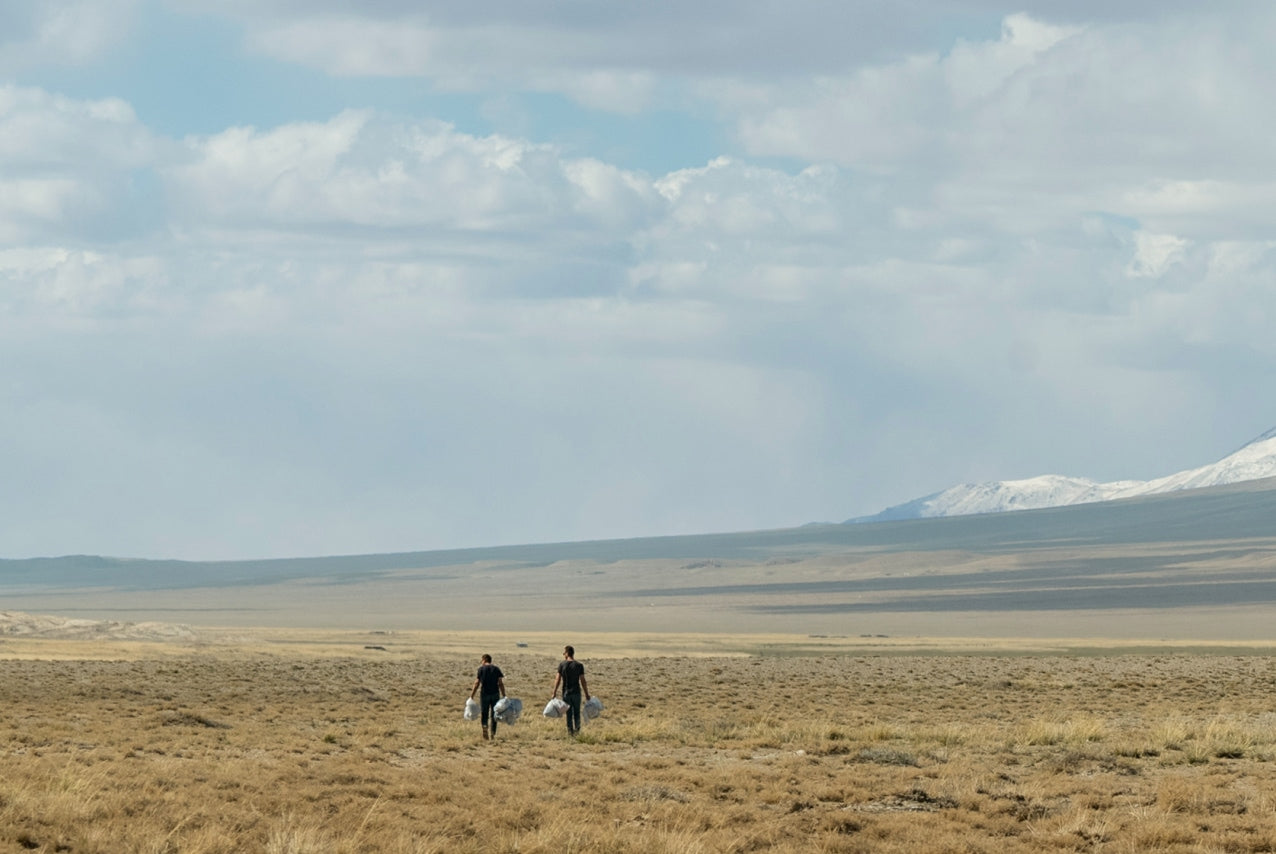 NAADAM founders with goats in Mongolia