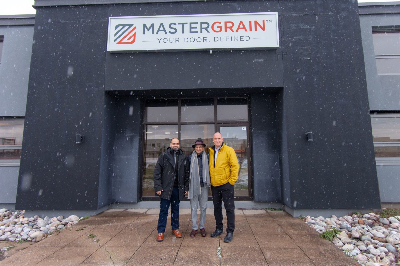 Nabil Kassam, Iqbal Kassam and Chris Edwards outside the Mastergrain manufacturing facility in snowy Midland, Ontario.