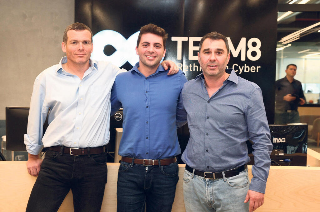 Team8 co-founders Nadav Zafrir, Liran Grinberg and Israel Grimberg standing together in their office