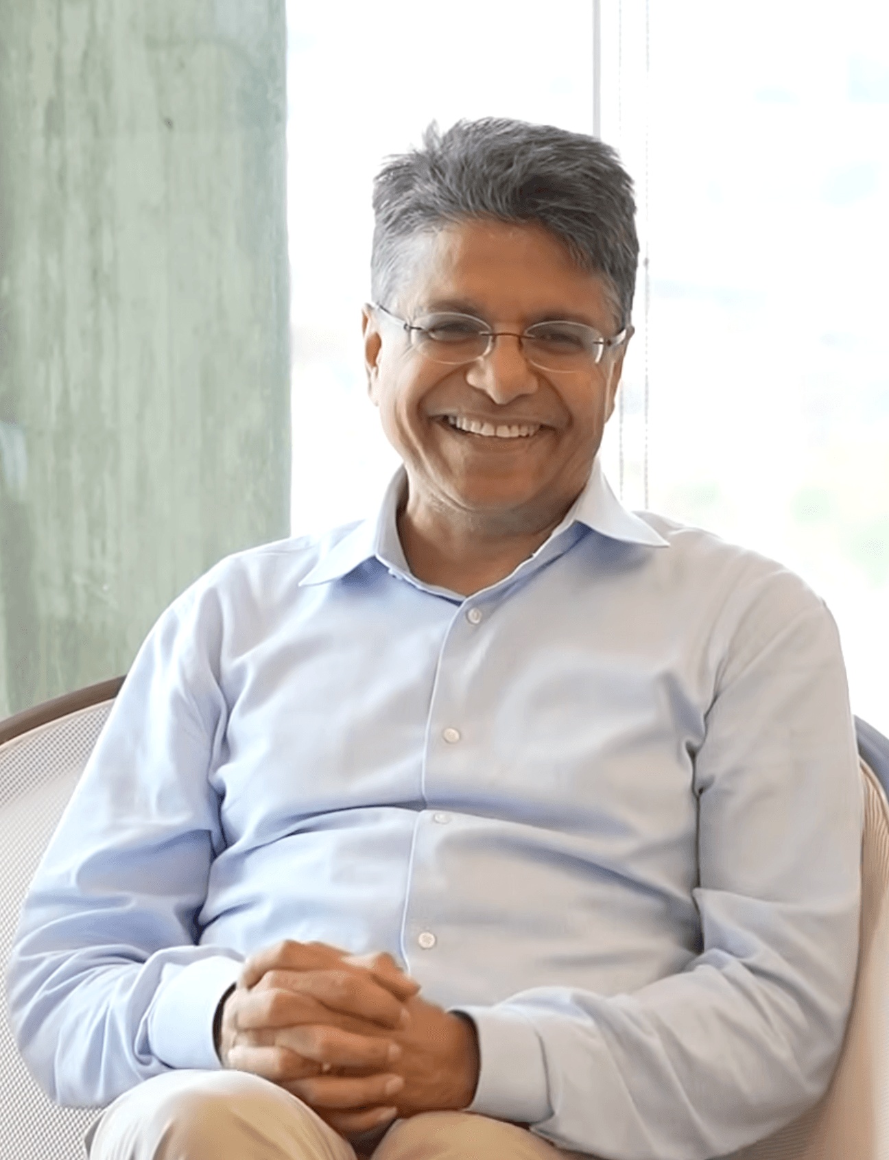 Naehas founder and CEO Rab Govil seated beside a window