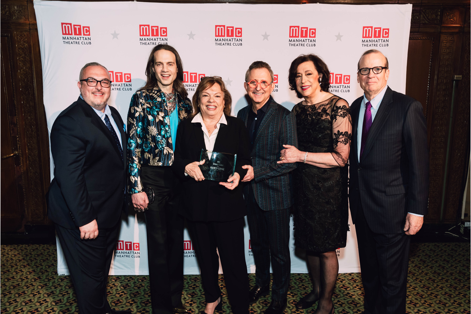 Nancy Coyne, third from left, with five theater colleagues at Manhattan Theatre Club’s 2019 gala