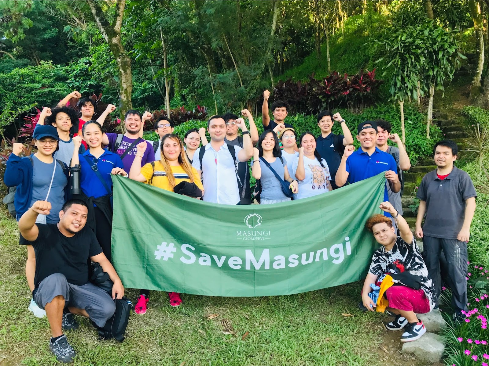 NarraSoft employees holding a Save Masungi banner at the georeserve