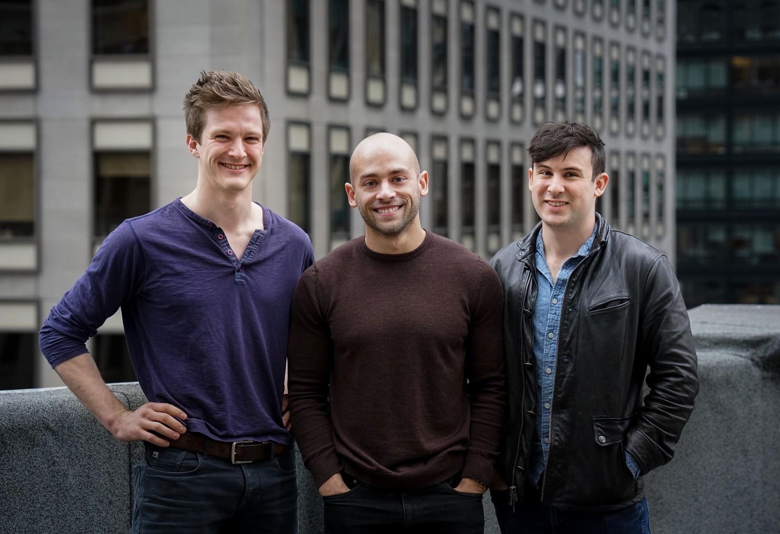 Qualia’s three co-founders together outdoors, with Nate Baker at left
