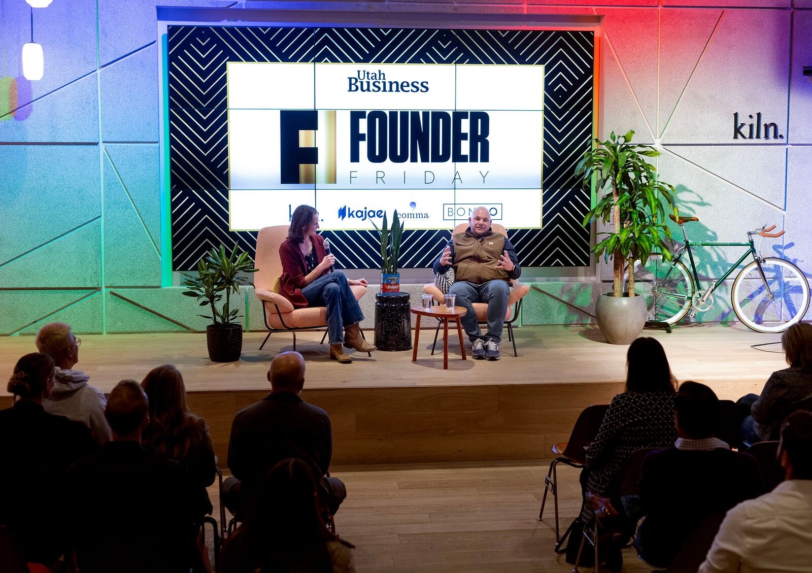 Nate Walkingshaw speaking with Melanie Jones on stage at Founder Friday in Salt Lake City
