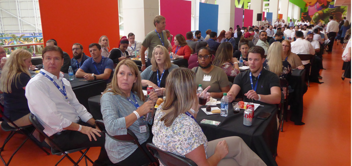 Apex Global Solutions colleagues seated together at the 2021 American Dream staff event
