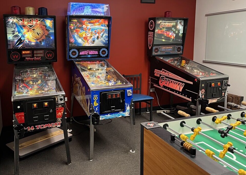 A row of vintage pinball machines displayed at Spectra Logic headquarters