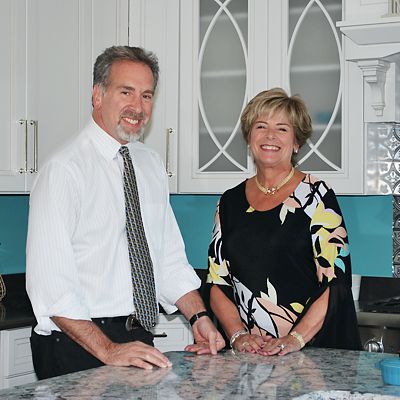 Historical photograph of Steven Kaitz and Margie Kaitz at the Mansfield Kitchen Views showroom
