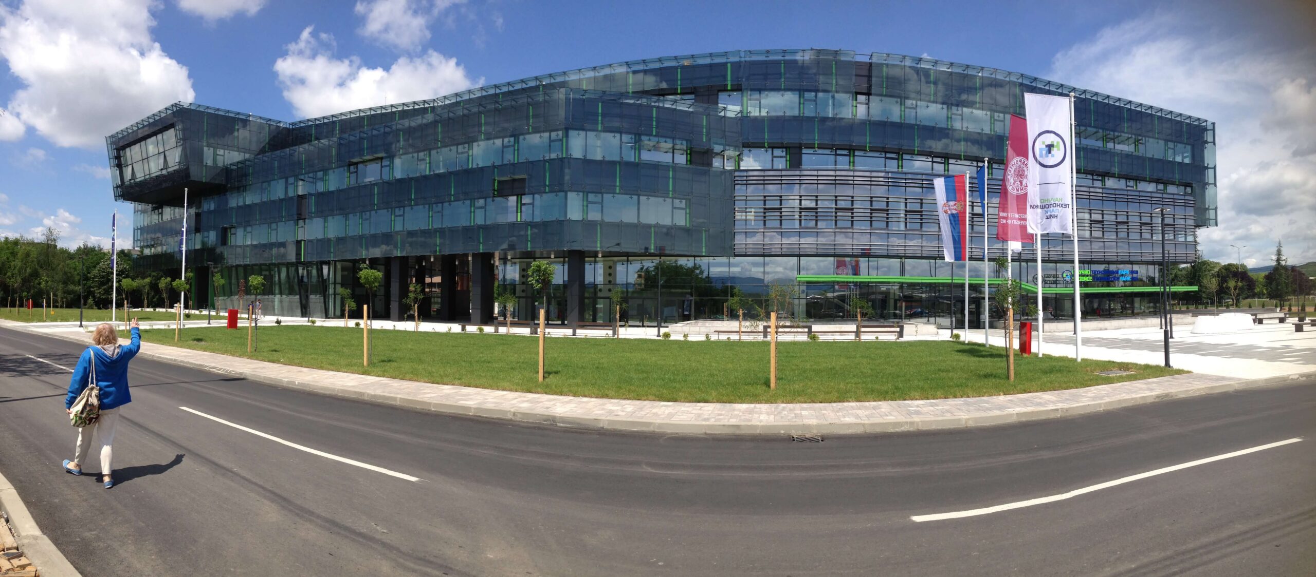 Glass facade of Science and Technology Park Niš beside a broad walkway