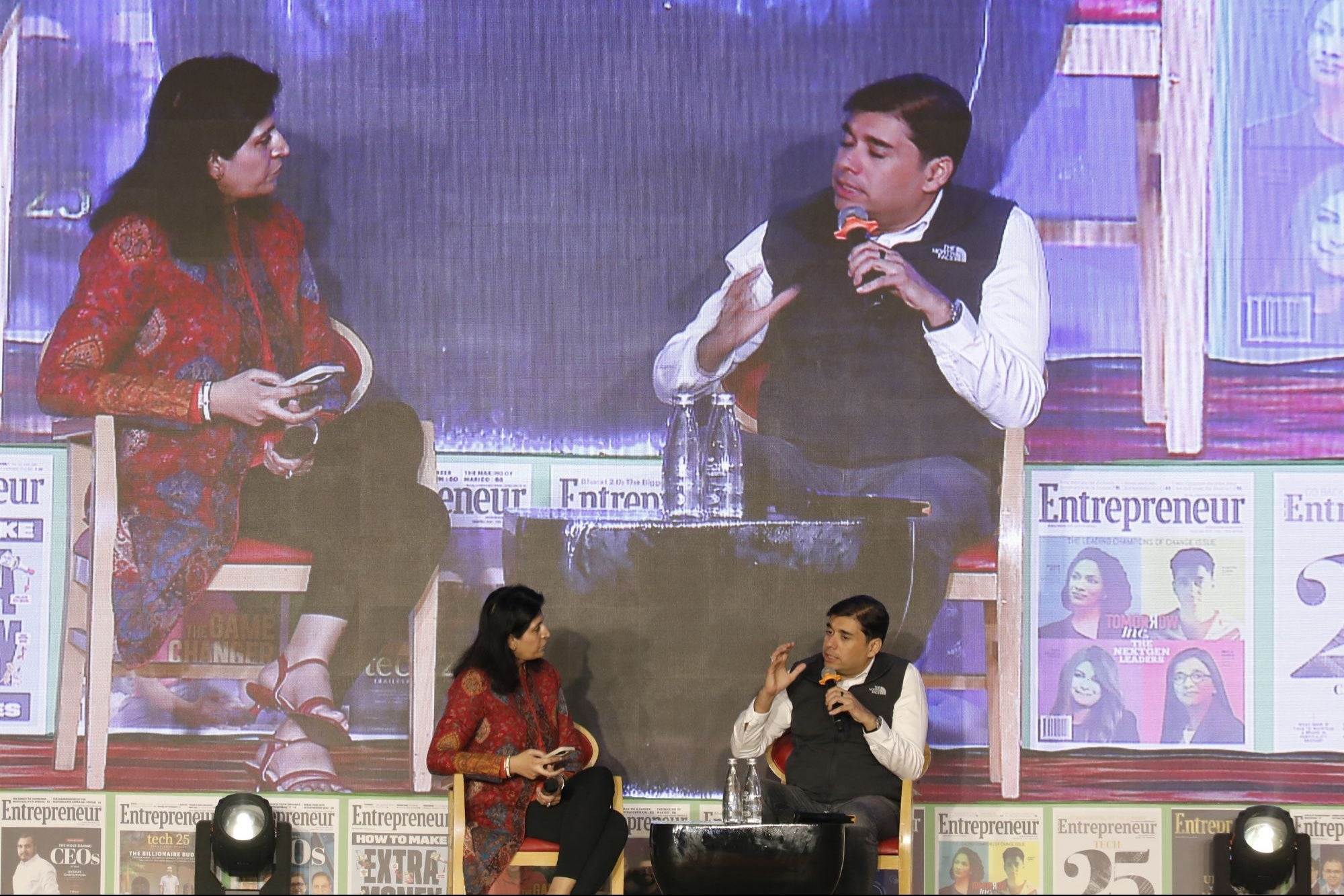Naveen Tewari speaking with Ritu Marya on stage at the Tech and Innovation Summit 2025