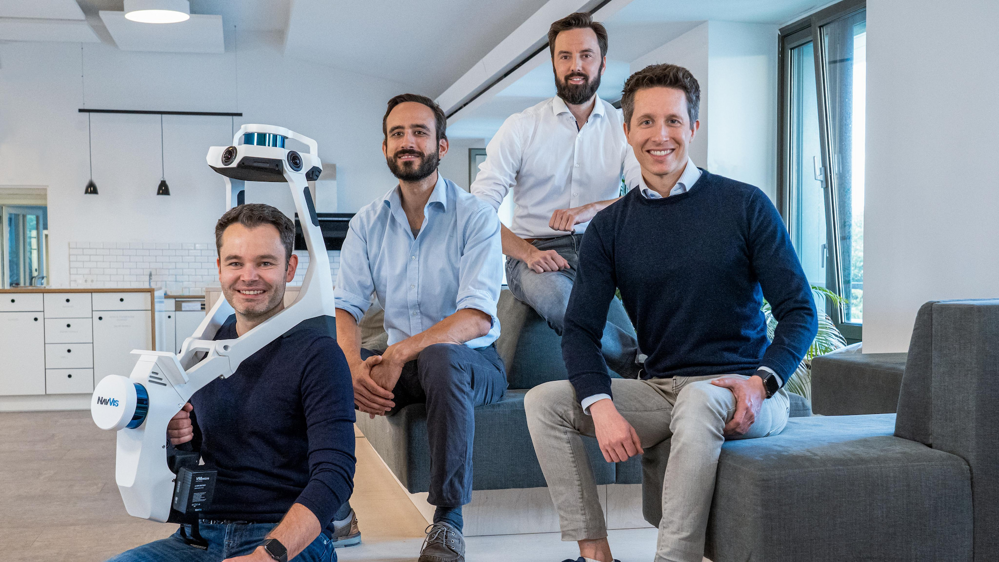 NavVis’s four co-founders pictured with a wearable laser scanner