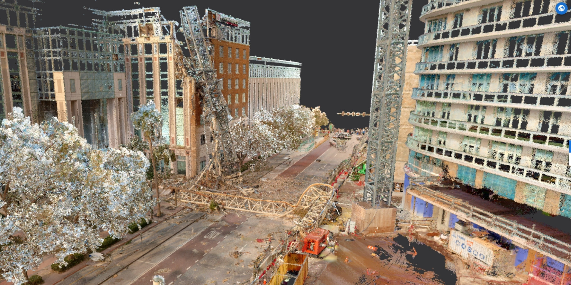 Point-cloud view of hurricane damage, including fallen structures across a street