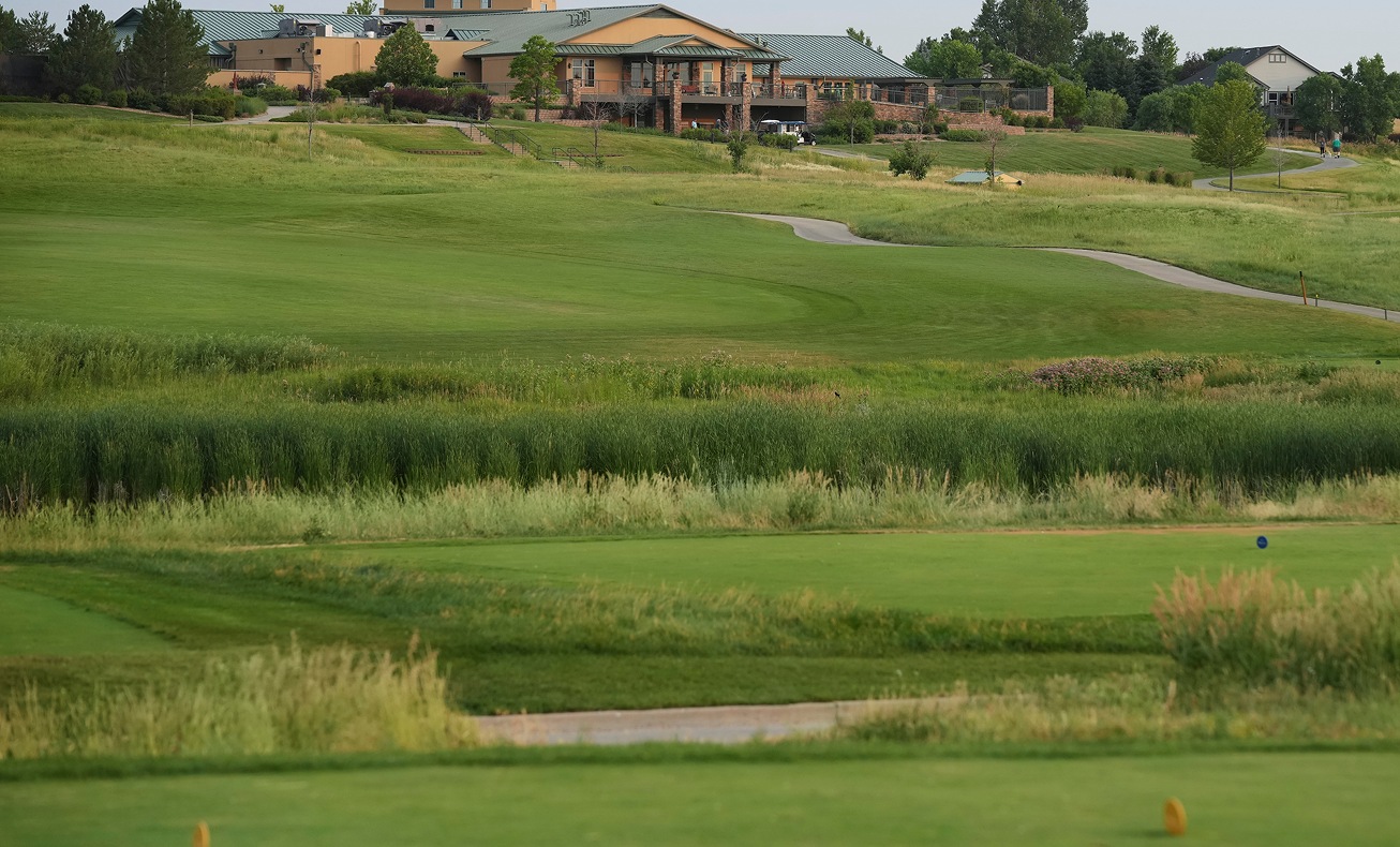 Fairways and clubhouse in a course photograph used on the GolfNow Pro product page